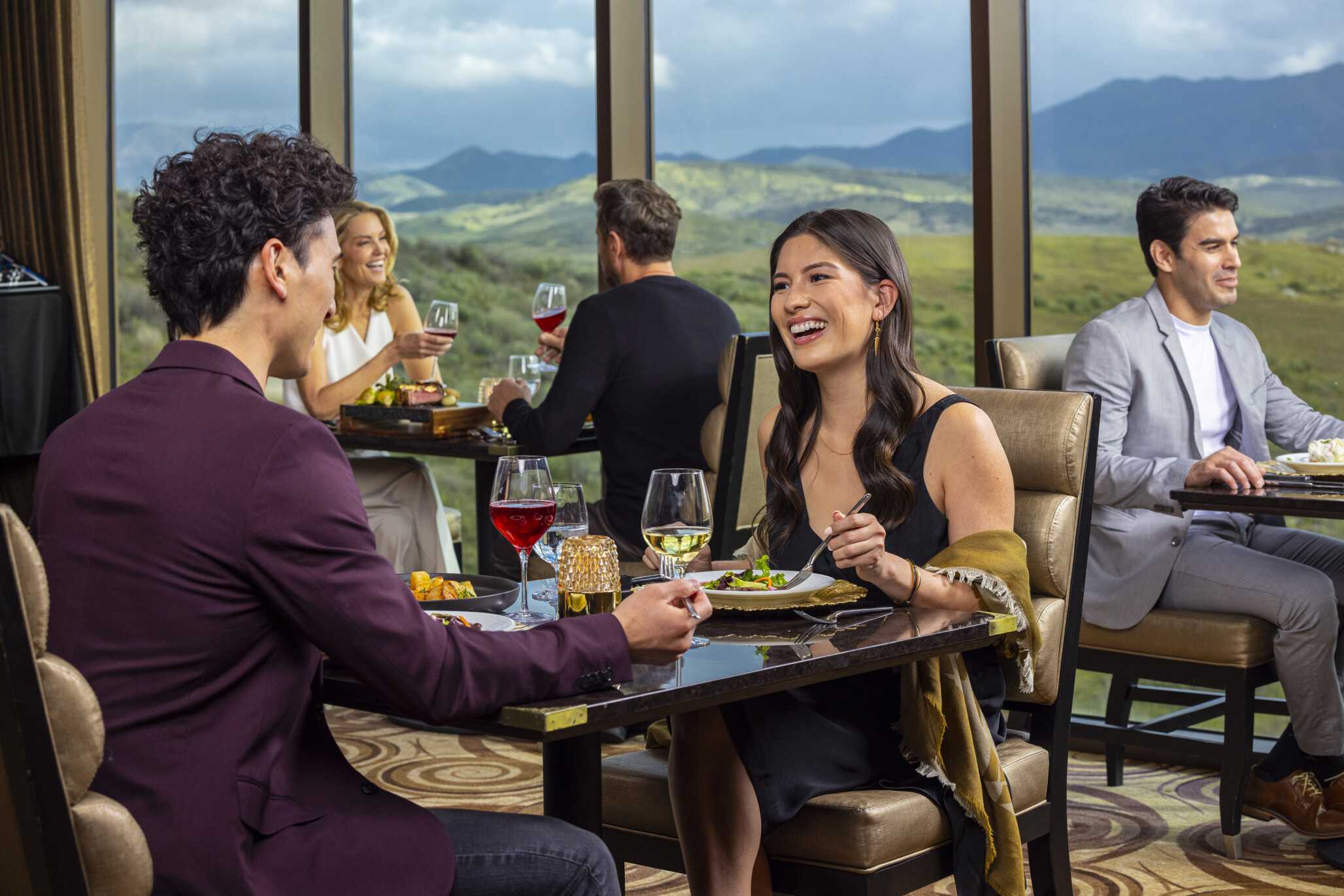 An elegant couple having dinner at Prime Cut Steakhouse & Seafood.