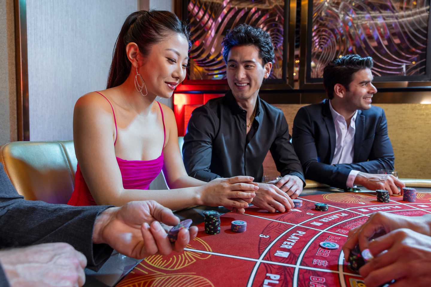 Young people having a good time playing table games in San Diego's Jamul Casino Resort.
