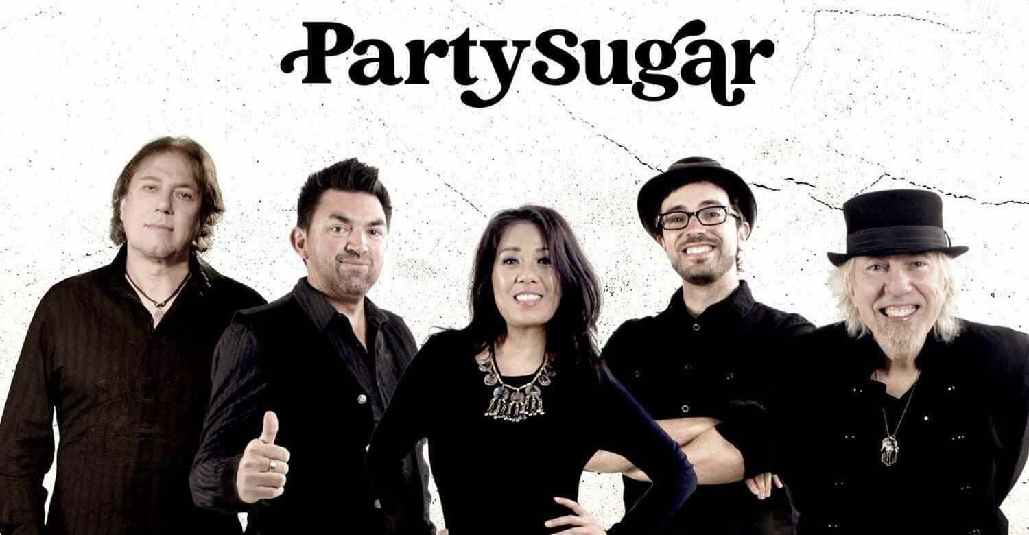 Party Sugar band group photo featuring five members dressed in black, smiling and posing against a light textured background.
