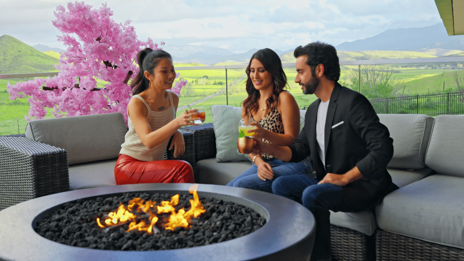 Three friends enjoying drinks at Jamul Casino Resort rooftop