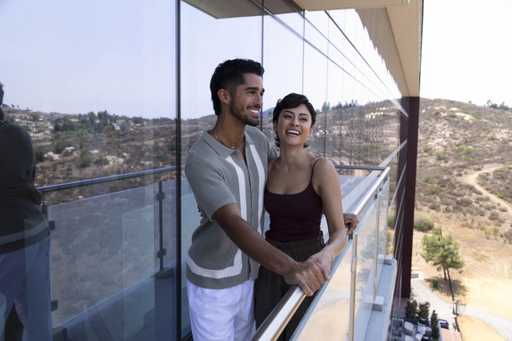 Couple laughing on their suite terrace at Jamul Casino Resort